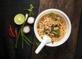 Instant noodles in plastic bowl and vegetable side dishes on woo Royalty Free Stock Photo