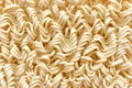 Instant noodles texture background. Uncooked egg noodle.