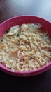 Instant noodles with tofu and egg in a bowl on the table. Indonesian noodle with thick broth