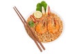 Instant noodles Tom Yam Kung has chopsticks and fresh shrimp. On a white background