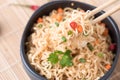 Instant noodles with vegetables on chopstick Royalty Free Stock Photo