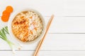 Instant noodles and vegetables on white wooden background, Top view of noodle and seasonings in cup on wood table Royalty Free Stock Photo