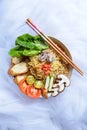 Instant noodles with warm and savory vegetarian special soup in a white bowl