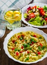 Instant noodles in white bowl on wooden table background and vegetables salad Royalty Free Stock Photo