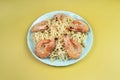 Fried Instant Noodles on a yellow background with Shrimps Asian Thai food fusion style easy dish street food popular