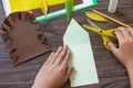 Instruction step 4. Postcard hedgehog with an apple on a wooden table. Handmade. Project of children`s creativity, handicrafts, Royalty Free Stock Photo