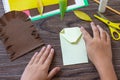 Instruction step 5. Postcard hedgehog with an apple on a wooden table. Handmade. Project of children`s creativity, handicrafts, Royalty Free Stock Photo