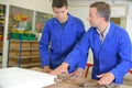 Instructor and apprentice looking at radiator Royalty Free Stock Photo