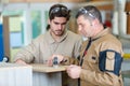 instructor with apprentice in workshop