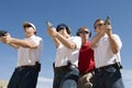 Instructor Assisting People With Guns At Firing Range Royalty Free Stock Photo