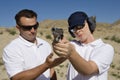 Instructor Assisting Woman With Hand Gun Royalty Free Stock Photo