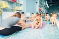 Instructor with children doing exercises
