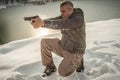 Instructor demonstrate body position of gun shooting on shooting range