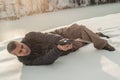 Instructor demonstrate body position of gun shooting on shooting range