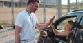 Instructor giving a five to a woman driver sitting in the car while learning to drive on the training ground. Driver Royalty Free Stock Photo