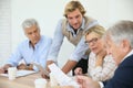 Instructor helping seniors in class Royalty Free Stock Photo