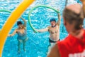 Instructor leading water aerobic class for seniors in the swimming pool Royalty Free Stock Photo