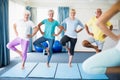 Instructor performing yoga with seniors Royalty Free Stock Photo