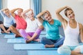 Instructor performing yoga with seniors