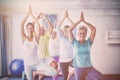 Instructor performing yoga with seniors Royalty Free Stock Photo