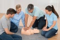 Instructor Showing Cpr Training On Dummy Royalty Free Stock Photo