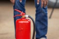 Instructor showing how to use a fire extinguisher on a training Royalty Free Stock Photo