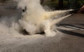 Instructor showing how to use a fire extinguisher on a training Royalty Free Stock Photo