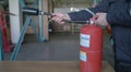 The instructor shows how to use the fire extinguisher Royalty Free Stock Photo