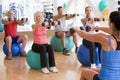 Instructor Taking Exercise Class At Gym Royalty Free Stock Photo