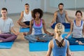 Instructor taking yoga class Royalty Free Stock Photo