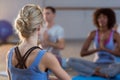 Instructor taking yoga class Royalty Free Stock Photo