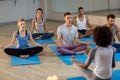 Instructor taking yoga class Royalty Free Stock Photo