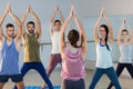 Instructor taking yoga class Royalty Free Stock Photo