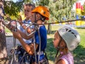 The instructor teaches children safety measures when visiting the rope park