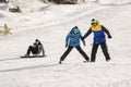 The instructor teaches how to ski on snow downhill ski training on the resort Dombay