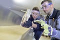 Instructor and trainee doing carpentry Royalty Free Stock Photo