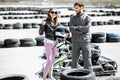 Instructor with woman on the go-kart track