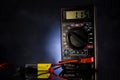 Instrument for measuring electric energy; check the battery charge on a black backlit background