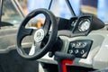 Instrument panel and steering wheel of a motor boat cockpit yacht control bridge Royalty Free Stock Photo