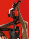 Instrument on stage and band. Fetish, sexy woman, electric guitar and legs, underwear. Fetish lingerie. Music concept