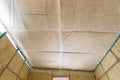 Insulated ceiling of a country house, insulation is closed with a vapor barrier film