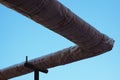 Insulated heating pipes outdoors against the sky Royalty Free Stock Photo