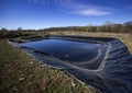 Insulated leachate pond with dirty water, part of landfill Royalty Free Stock Photo