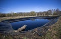 Insulated leachate pond with dirty water, part of landfill