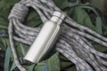 Insulated Stainless Bottle with climbing rope Royalty Free Stock Photo