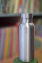Insulated Stainless Bottle with colorful bookshelf background