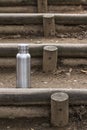 Insulated Stainless Bottle on log steps in the forest