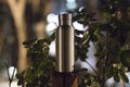 An insulated stainless steel bottle at the forest in the night