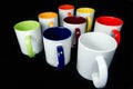 Insulated unprinted cups for sublimation of different shapes, colors and designs designer on a black background isolated