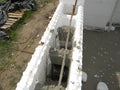 Insulating concrete forms ICF with reinforced concrete house walls. Insulating concrete forms ICF made of plastic foam that